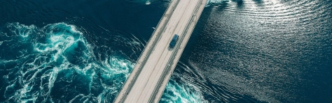 Car driving across a bridge