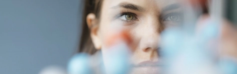Woman looking at DNA molecules